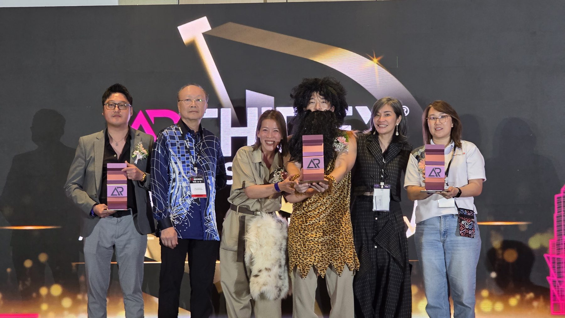 The team receiving the Best Booth Design Gold award at ARCHIDEX 2026