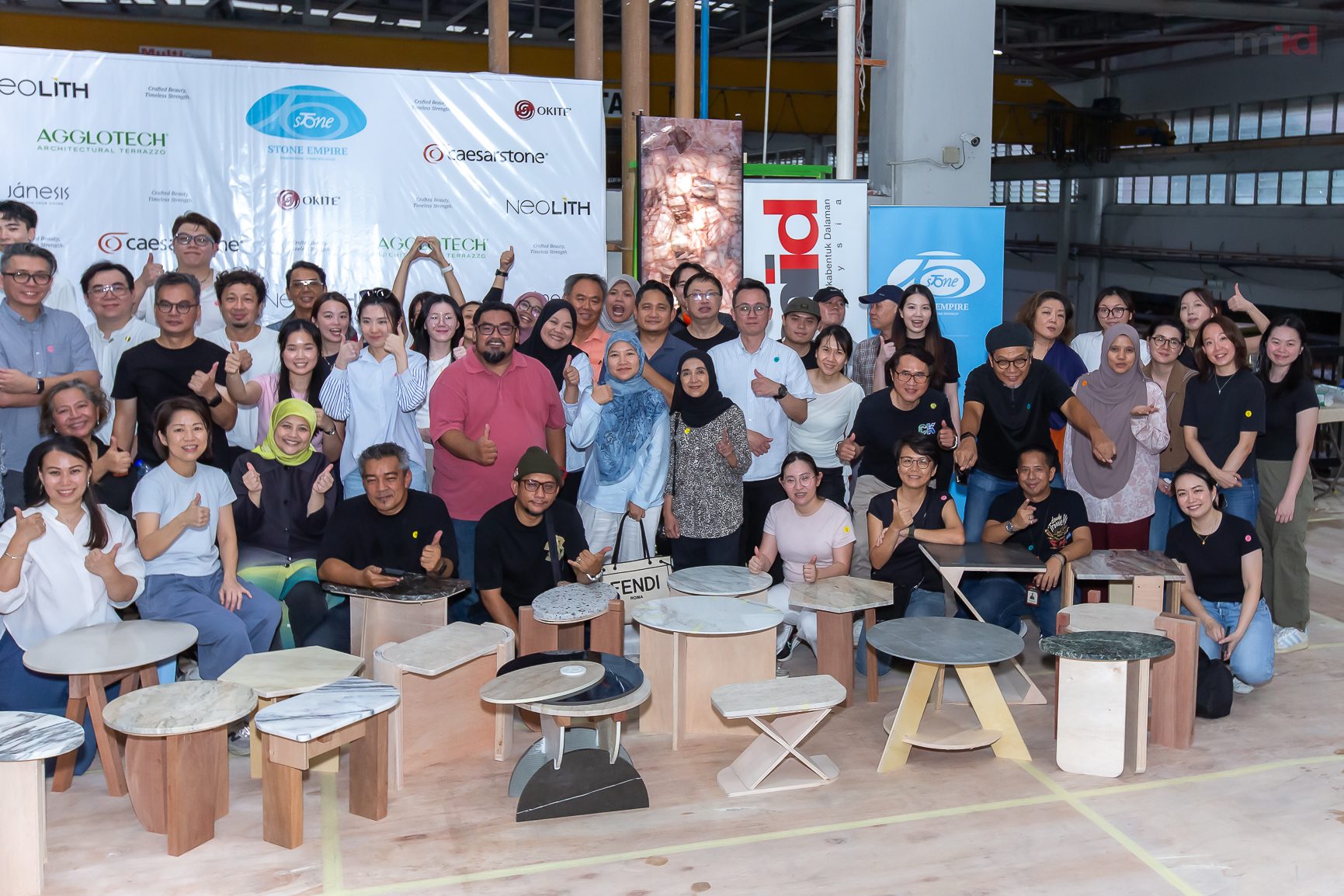 Participants with the furniture pieces completed during the workshop
